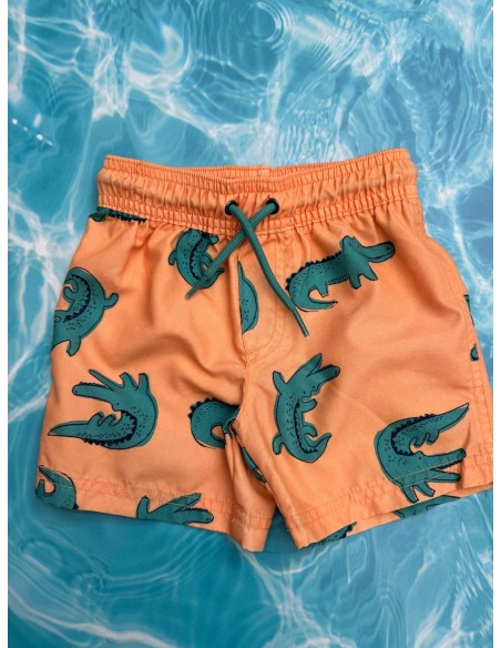 pantalon de baño naranja con cocodrilos