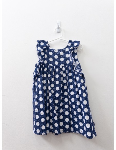vestido azul con bolas blancas y lazo amarillo