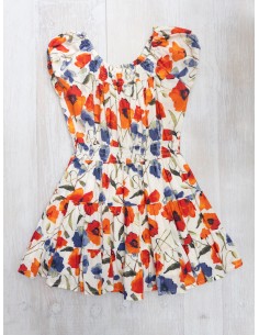 vestido blanco con flores naranjas y azules