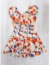 vestido blanco con flores naranjas y azules
