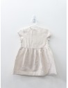vestido beige con circulos dorados