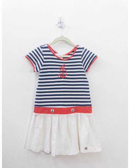 vestido falda blanca y top rayas azules y blancas con ancla roja