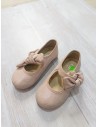 zapatos rosados con lazo y brillos
