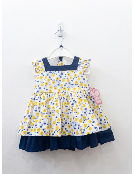 vestido blanco con flores amarillas y detalles azul