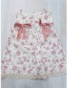 vestido blanco con flores rosadas y lazos
