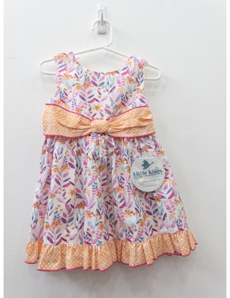 vestido flores y cinton naranja con bolas blancas