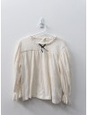 camisa beige con lazo negro