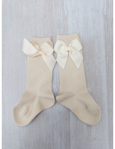 medias beige con lazo