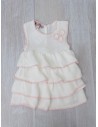 vestido de punto blanco con detalles rosa