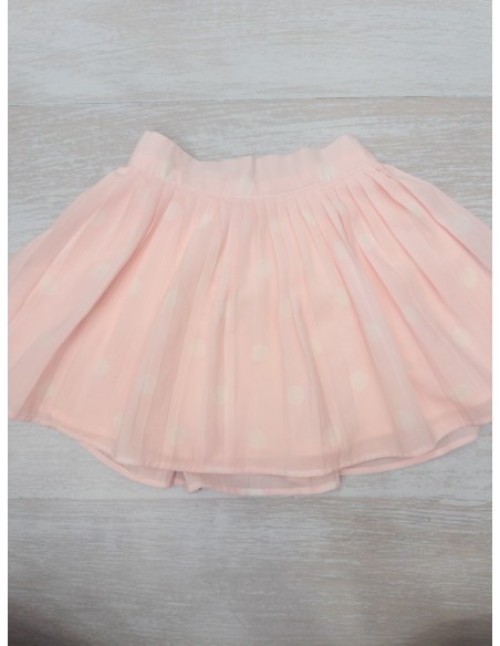falda rosa con bolas blancas