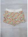 short blanco con flores naranja y rosadas