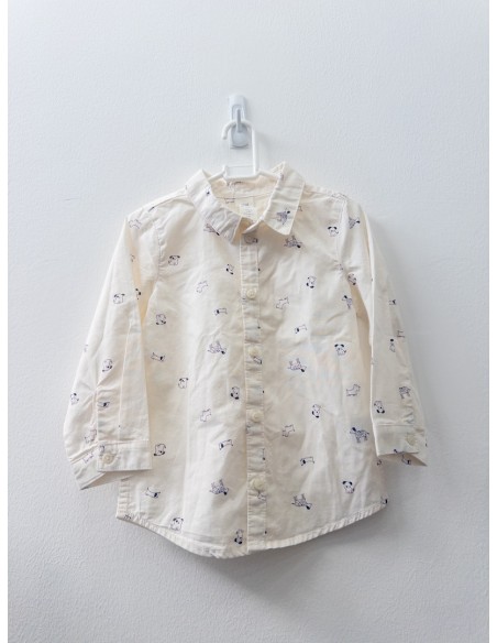 camisa beige con dibujos de perros negros