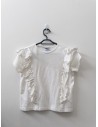 top blanco con vuelos