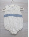 enterizo blanco con bolitas celestes y cinton celeste