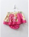 falda con calzon fucsia con bolas blancas y vere con flores