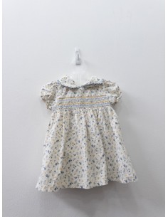 vestido beige con flores azules y amarillas